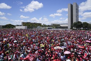 Supporters of Luiz Inacio Lula da Silva gather to attend his inauguration as new president outside the Planalto presidential palace in Brasilia, Brazil, Sunday, Jan. 1, 2023